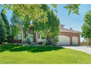 Gorgeous brick exterior with stately entrance and mature landsca