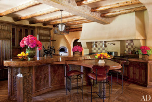 Architect Stephen Samuelson fashioned kitchen cabinetry from 19th-century Nuristani oak panels for Will and Jada Pinkett Smith’s Malibu property. Interior decorator Judith Lance designed the interiors.