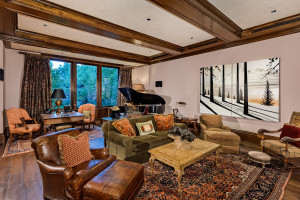 Wood ceiling beams and flooring create warmth in the family room.