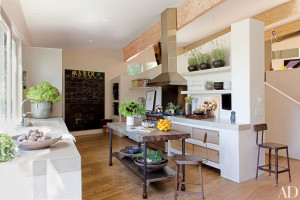 At Jillian and Patrick Dempsey’s Malibu, California, home devised by Estee Stanley Interior Design, the kitchen features a concrete sink and countertops as well as a Wolf range and a Best hood.