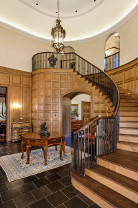 A grand staircase leads to the second level.
