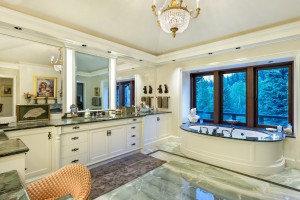 Marble finishes and flooring create a spalike elegance in the master bath.