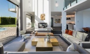 Sliding glass doors in the sunken living room open up to the terrace.